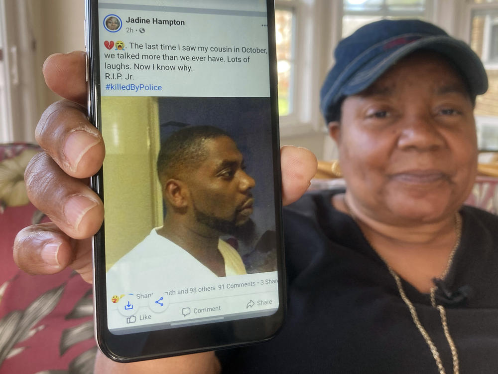 Andrew Brown Jr. was shot in the back of his head, his family's attorneys said Tuesday, citing an independent autopsy. Here, Glenda Brown Thomas displays a photo of Brown, her nephew, on her cellphone at her home in Elizabeth City, N.C.