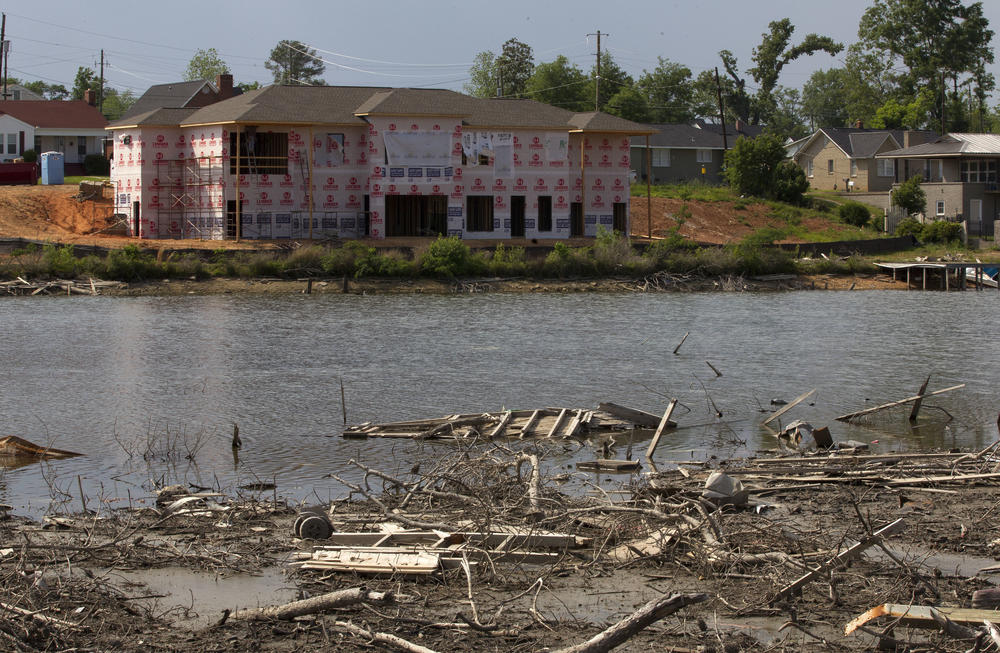 Some new construction is visible on debris filled Forest Lake in Tuscaloosa, Ala., in this photo taken Tuesday, April 10, 2012.