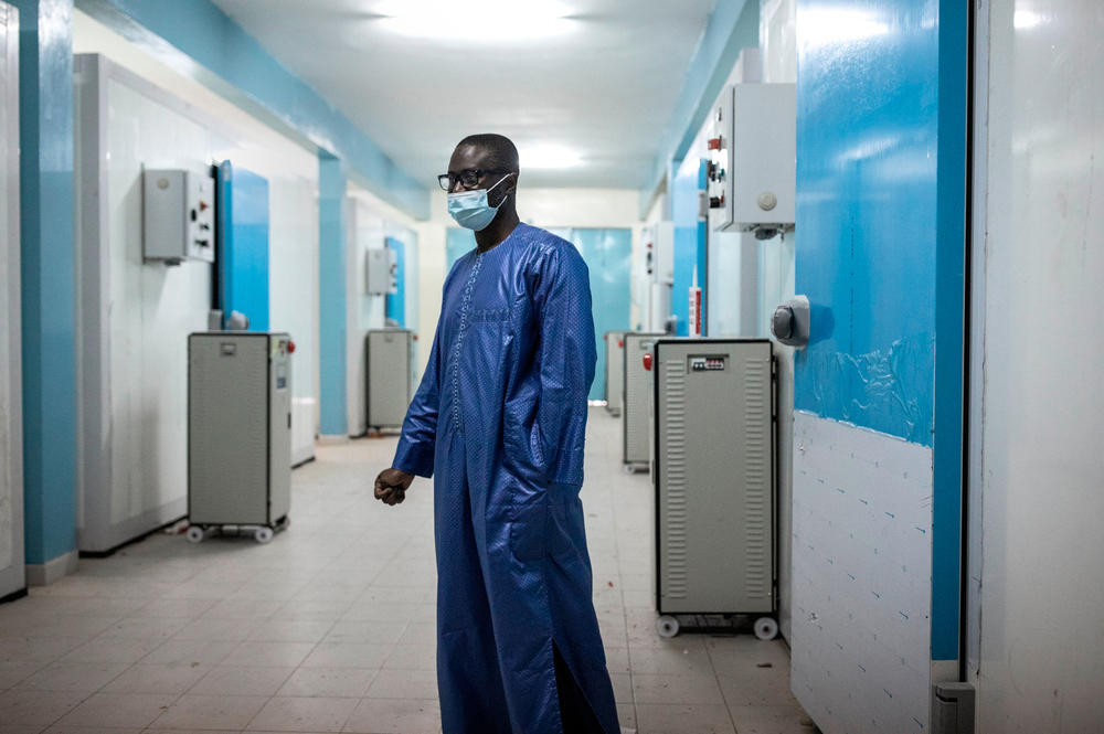 Ousseynou Badiane, the head of Senegal's vaccination program, stands in front of newly built cold rooms at Fann Hospital in Dakar, Senegal, in January. These cold rooms may be used to help store the country's stock of COVID-19 vaccines.