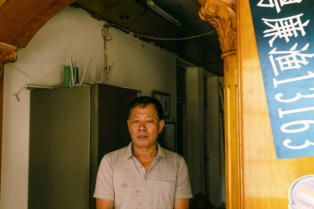 Feng Daokun in the apartment he rents in Zhuhai, China, where he lives with his mother, wife and children. In his sister's last call to him, the day before she was killed, 