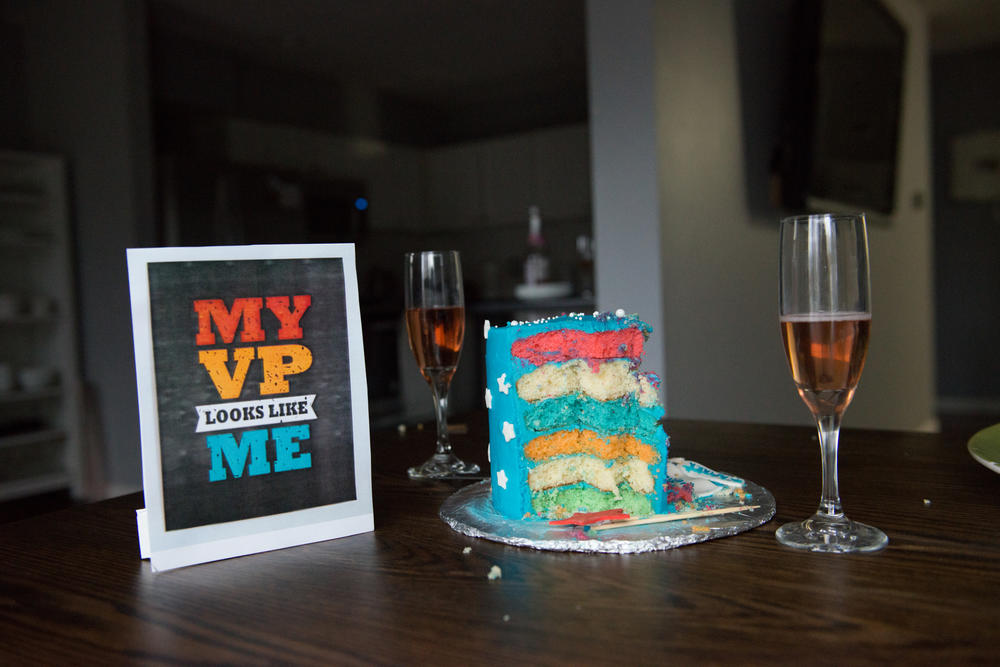 A cake, a glass of sparkling grape juice and other party props sit on a table at an Inaugration Day party at the Golla household in Chesterfield, Mo. Although the past year has been challenging, a high point for the South Asian community was to see Kamala Harris take the oath as vice president.