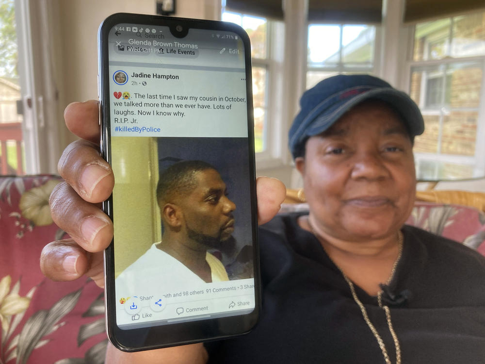Glenda Brown Thomas displays a photo of her nephew, Andrew Brown Jr., on her cellphone at her home last week in Elizabeth City, N.C. Brown was shot and killed by sheriff's deputies attempting to execute a warrant.