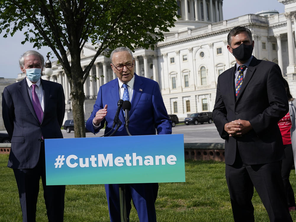 Senate Majority Leader Chuck Schumer, joined by Sens. Ed Markey (left) and Martin Heinrich, discusses legislation Wednesday to reimpose regulations to reduce methane pollution from oil and gas wells.