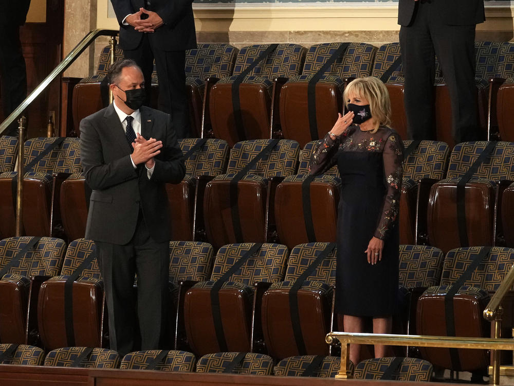 First lady Jill Biden, right, and second gentleman Douglas Emhoff — the first person to bear that title — were also in attendance.