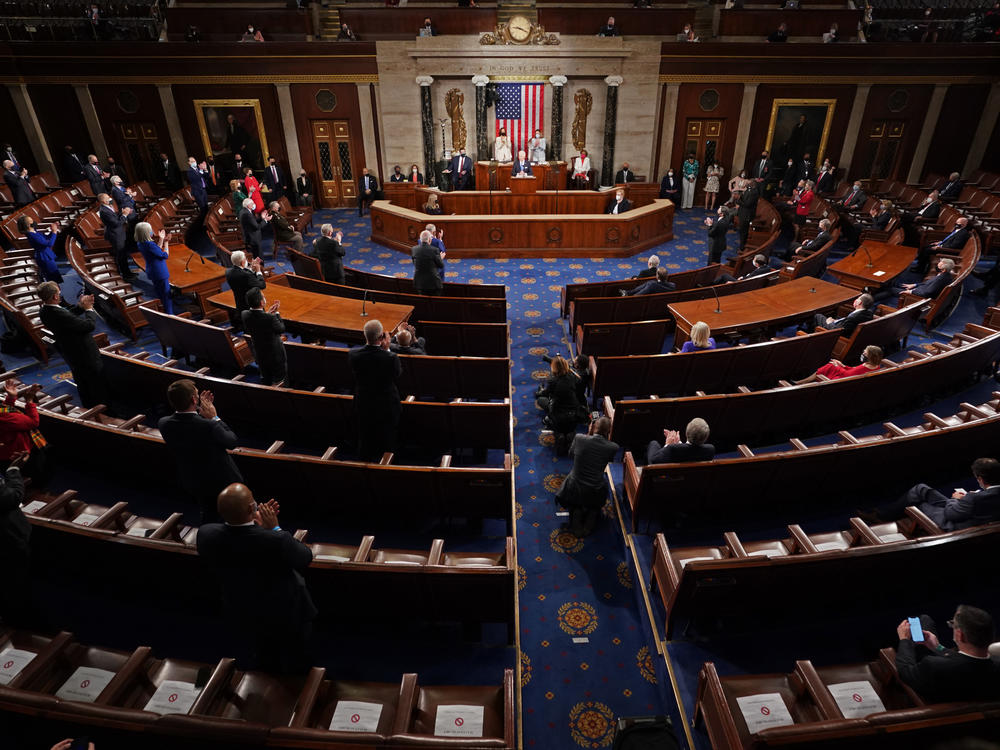 Biden addresses an unusually small crowd of lawmakers and government officials during a joint session of Congress.