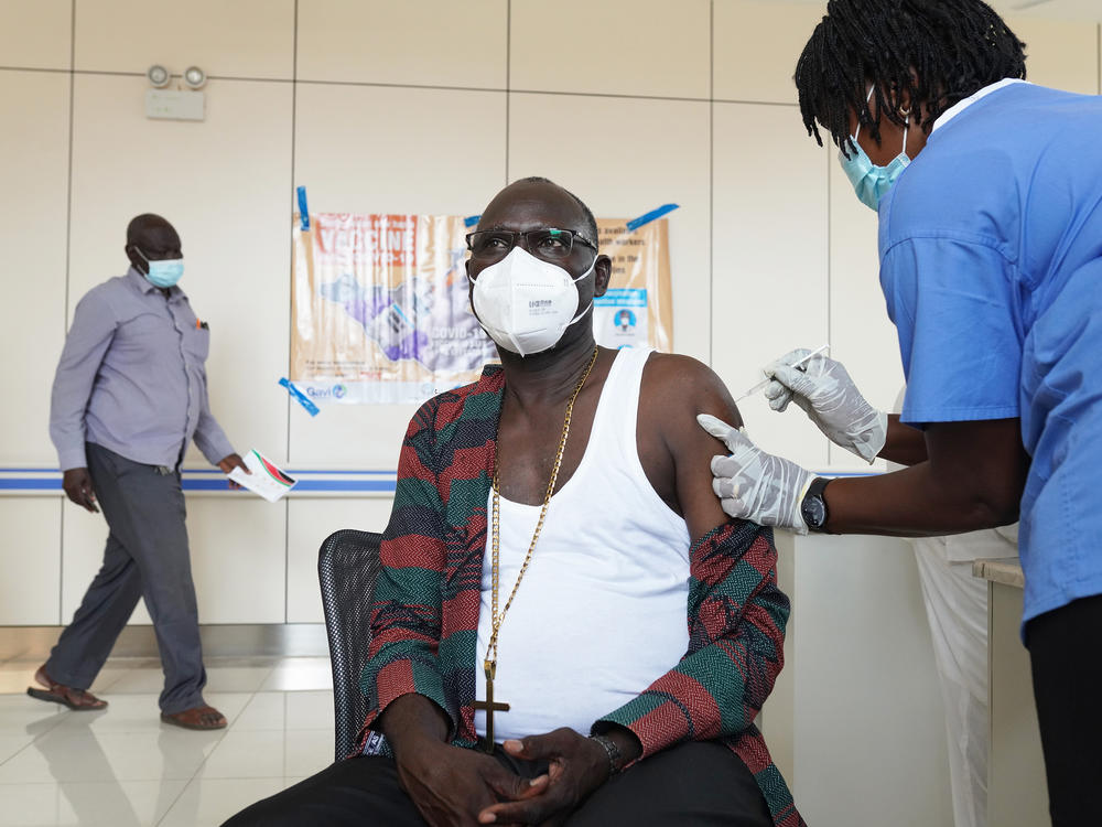 A bishop receives a vaccine for COVID-19 at Juba Teaching Hospital on April 7 in Juba, South Sudan. South Sudan received 132,000 doses of the Oxford-AstraZeneca vaccine on March 25 through the World Health Organization's COVAX program to ensure all countries have equal access to vaccines.