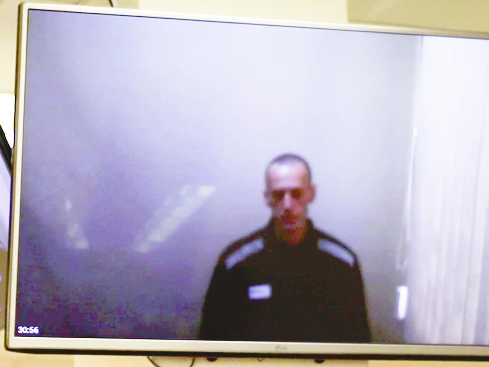 In this photo taken from a video provided by the Babushkinsky District Court in Moscow on Thursday, Russian opposition leader Alexei Navalny is seen during a hearing on charges of defamation.