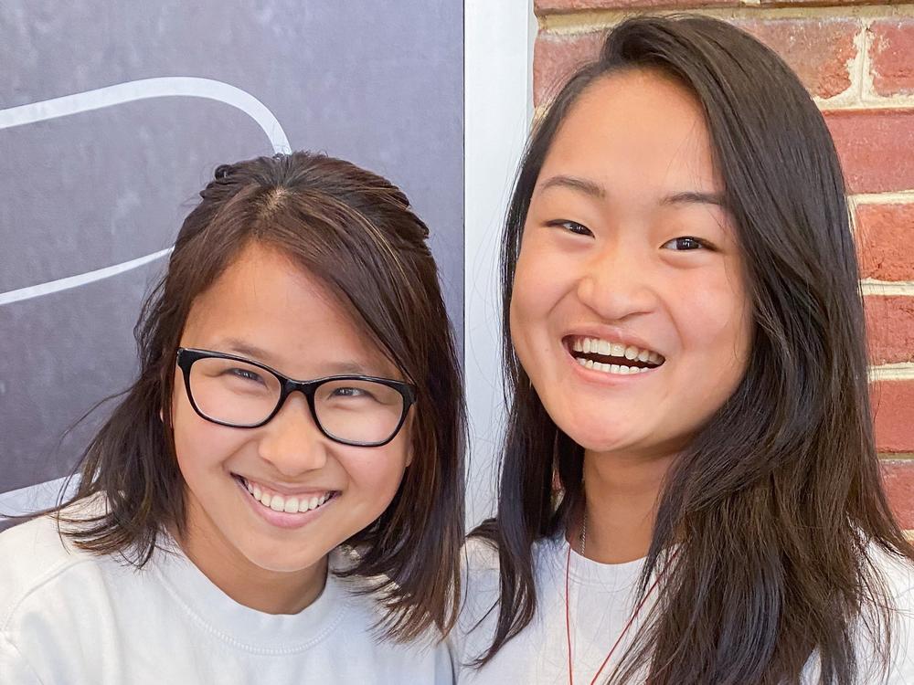 Ally Cole (left) and Ruby Wierzbicki show off the childhood photo that revealed a special connection.