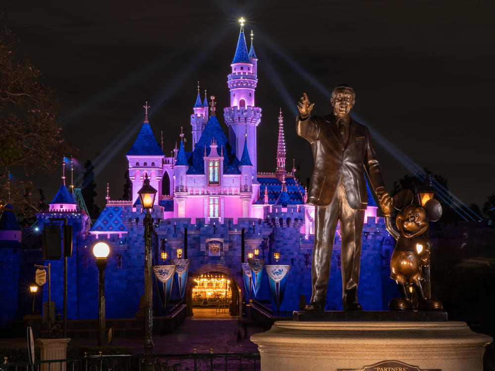 Disneyland's Sleeping Beauty Castle is lit up this week as the theme park prepares to reopen on Friday. California health restrictions allow the resort to operate at 25% capacity.