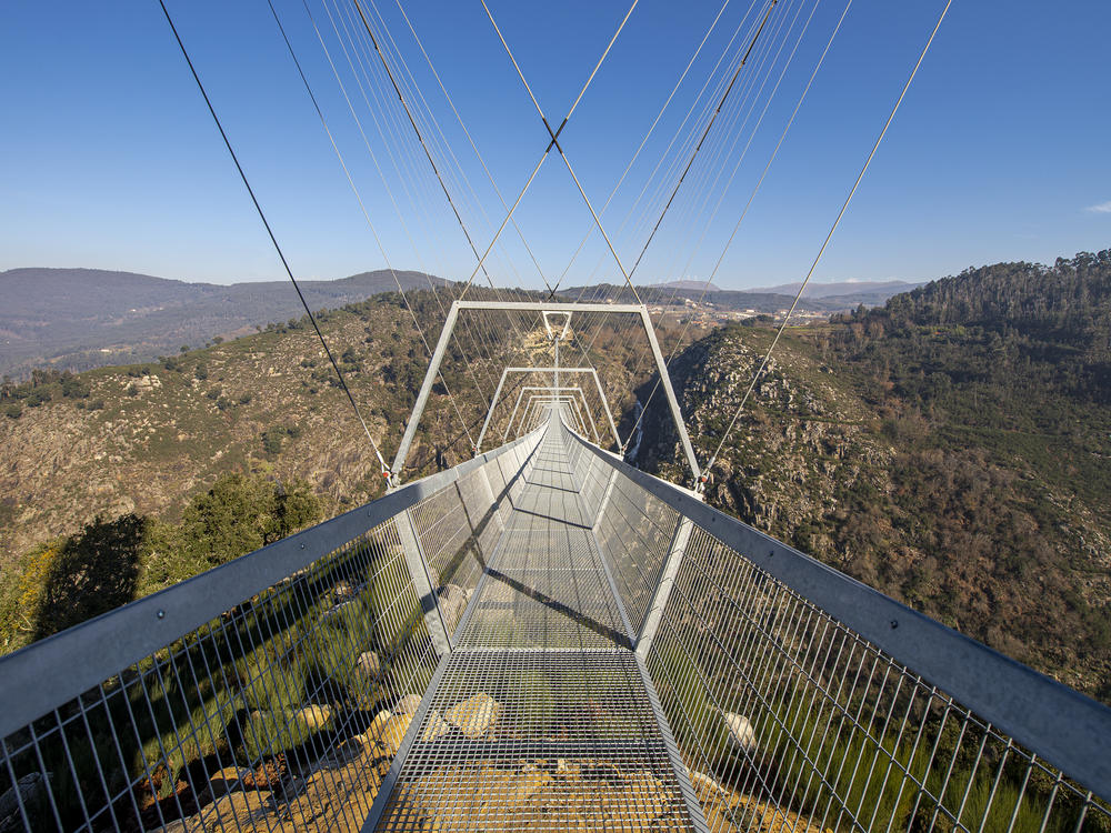 The 516 Arouca, the longest pedestrian suspension bridge in the world, hangs above the Aguieiras Waterfall in the Paiva Gorge in Arouca, Portugal. It is opening to the public next week.