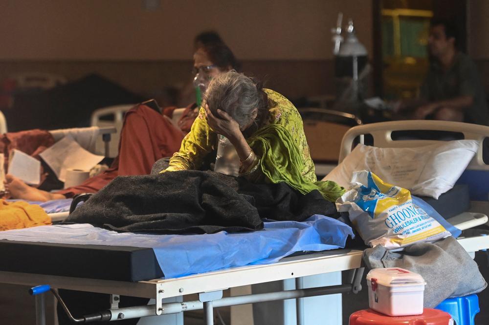 A patient rests inside a banquet hall converted into a COVID-19 ward on Tuesday in New Delhi.