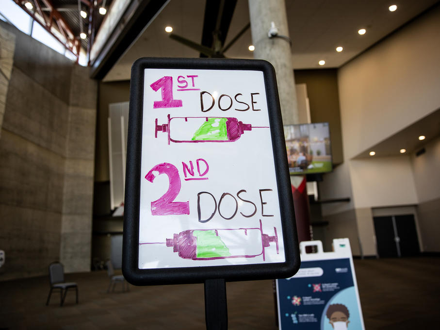 Signs direct people arriving to get COVID-19 vaccines last week at the Mountain America Expo Center in Sandy, Utah.