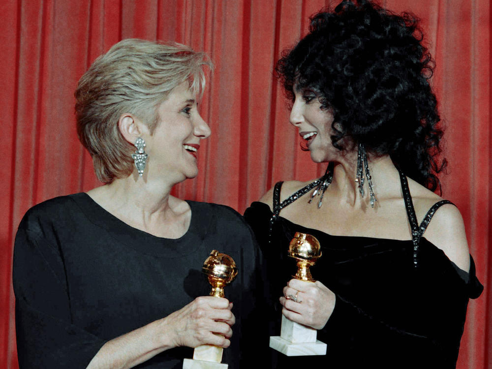 Olympia Dukakis and Cher hold the Golden Globe awards they received for performances in the hit movie <em>Moonstruck</em> in 1988. Later that awards season, they both won Oscars.