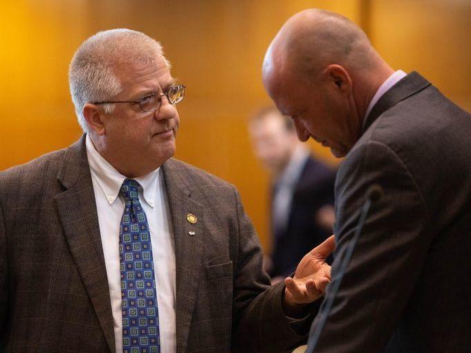 Rep. Mike Nearman, R-Polk County, chats with fellow representatives on the House floor on April 11, 2019, at the Capitol in Salem, Ore. He faces criminal charges after allowing far-right demonstrators to breach the state Capitol in December 2020.