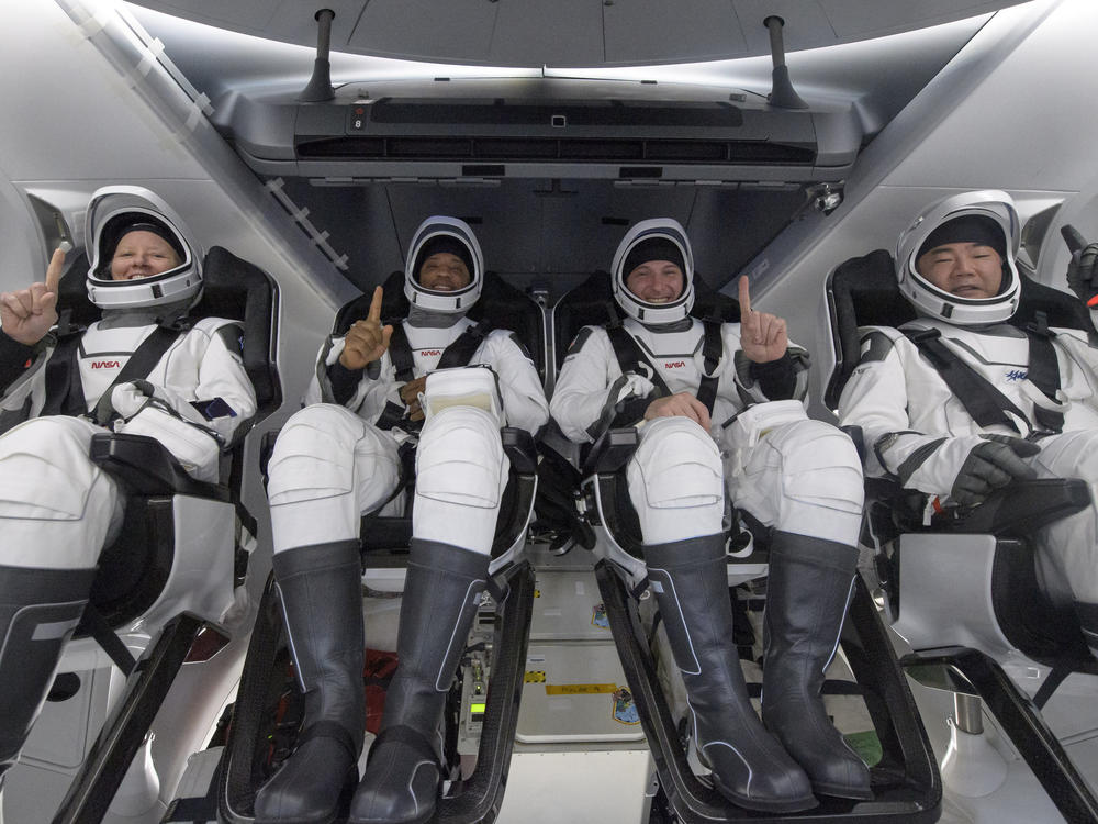 NASA astronauts Shannon Walker (left), Victor Glover, and Mike Hopkins, along with Japan Aerospace Exploration Agency astronaut Soichi Noguchi, are seen inside the SpaceX Crew Dragon Resilience spacecraft onboard the SpaceX GO Navigator recovery ship shortly after landing in the Gulf of Mexico off the coast of Panama City, Fla., on Sunday.