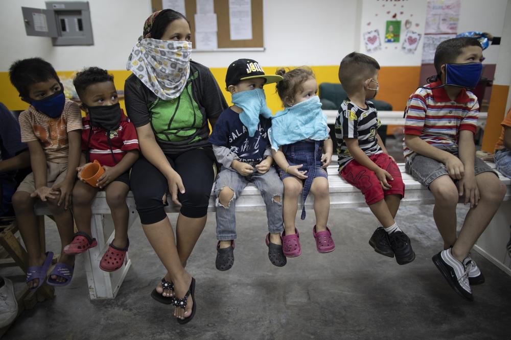 Children attend a care center with tutors in Caracas, Venezuela, Nov. 4, 2020. Many countries in Latin American and the Caribbean have shut schools during the coronavirus pandemic, and children from lower-income families are often unable to participate in online distance learning.