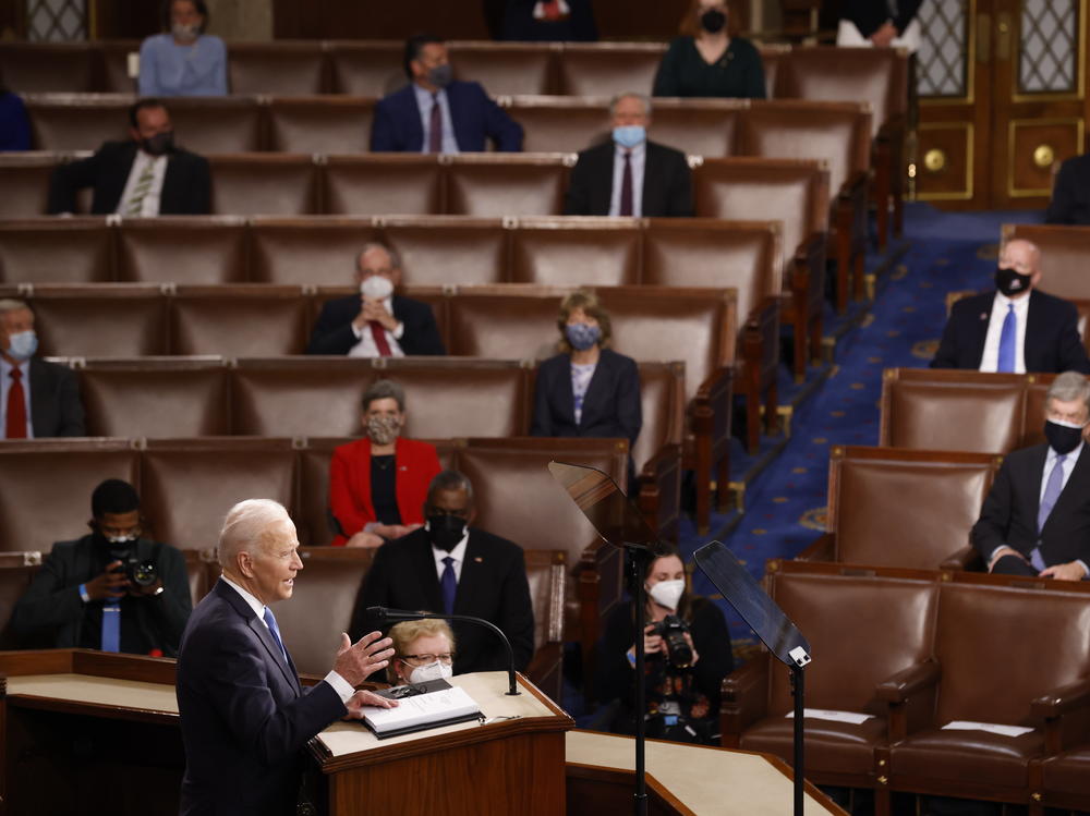 WASHINGTON, DC - APRIL 28: President Joe Biden addresses a Joint Session of Congress, with Speaker of the House Nancy Pelosi and Vice President Kamala Harris behind, on Capitol Hill in Washington DC.