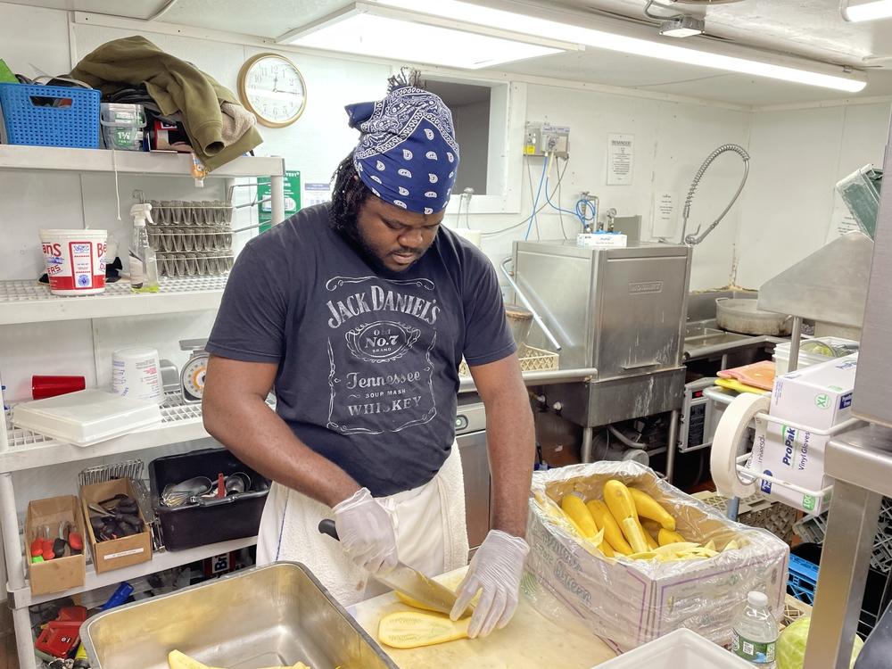 Jason Brissett, a kitchen worker who came to the U.S. last month from Jamaica through an H-2B visa, is bracing for 80-hour workweeks this summer to make up for staffing shortages.