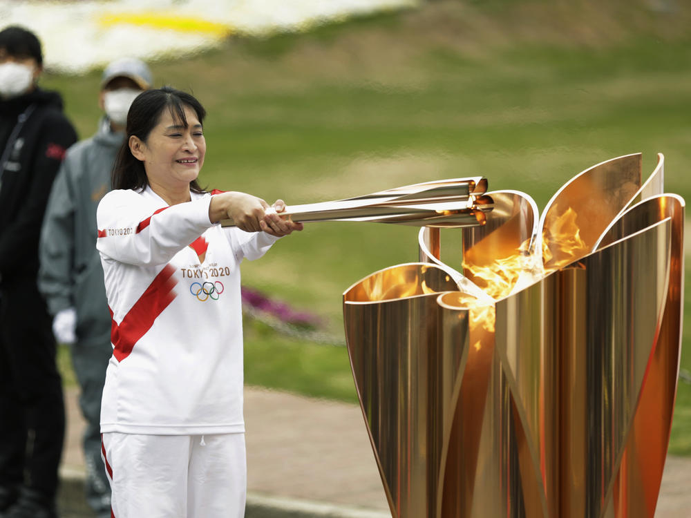 The last Olympic torch relay runner for the Osaka leg concludes the event in Suita, north of Osaka, western Japan, last month.