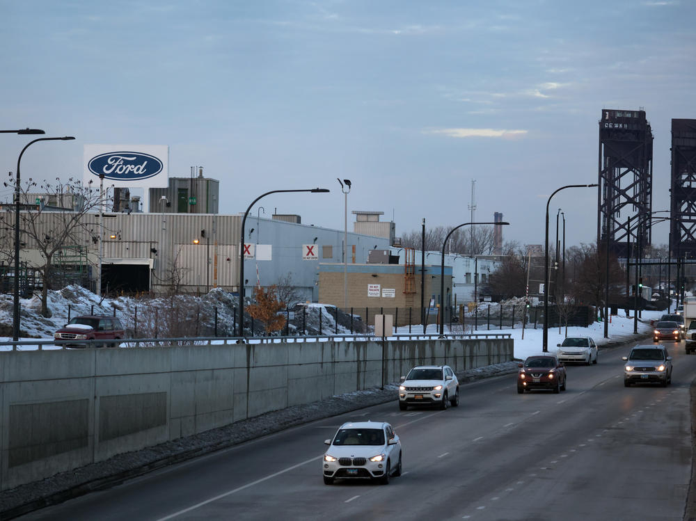 The Ford company logo is displayed above the Chicago Assembly Plant on Feb. 3. Ford is allowing many workers to work remotely — not just during the pandemic, but as routine policy. But of course, plant workers can't sign in to work from home.