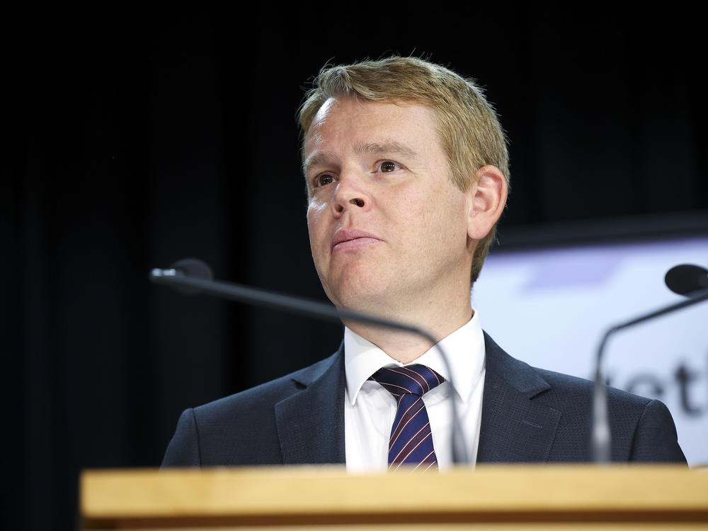 New Zealand Minister for COVID-19 Response Chris Hipkins looks on during a news conference at Parliament last month where he and Prime Minister Jacinda Ardern announced plans for a quarantine-free 