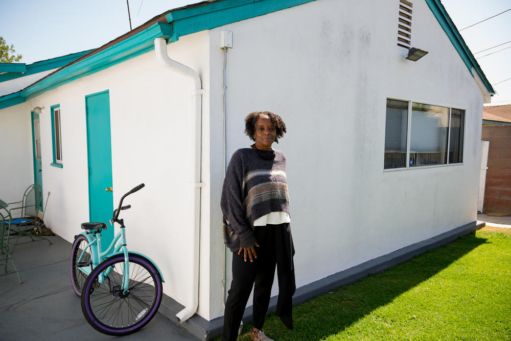 Back on her tree-lined street in Compton, DonnaLee Norrington sheds tears through a big smile as she reflects on her accomplishment. 