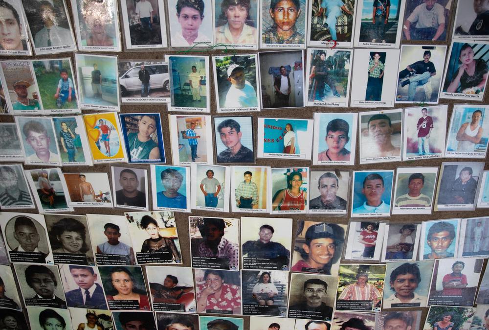 Portraits of missing migrants from Honduras posted by members of COFAMIPRO, which is composed of loved ones who stayed behind but have never stopped looking.