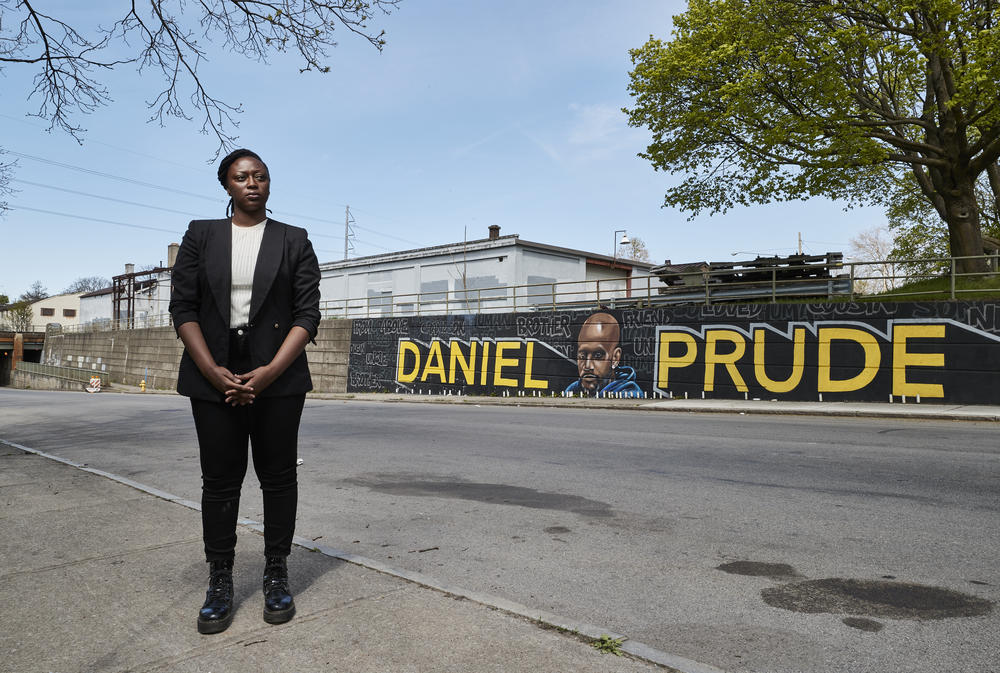 City Council candidate Stanley Martin stands in front of an informal memorial to Daniel Prude in Rochester, N.Y. Prude was a man with mental health and drug issues who died last year after being taken into police custody.