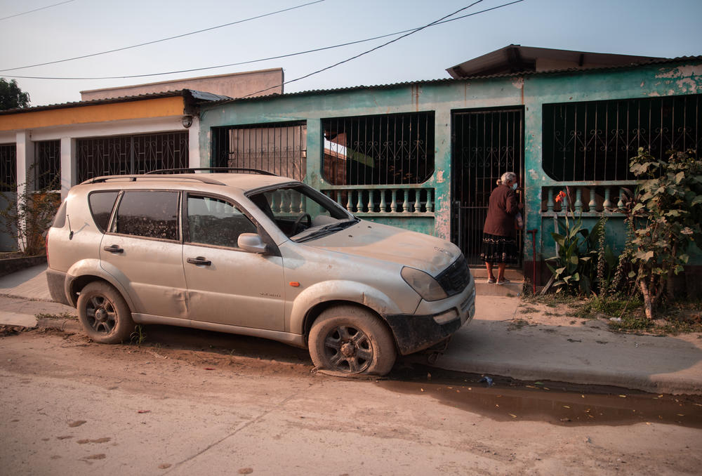 The Ciudad Planeta neighborhood of San Pedro Sula was turned into a vast muddy lake by the 2020 hurricanes. Sights like this truck ruined by the flood are still common.
