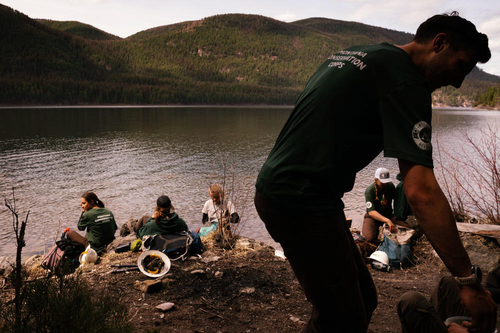 The Montana Conservation Corps crew breaks for lunch while spending the day working on  trails near Tally Lake.