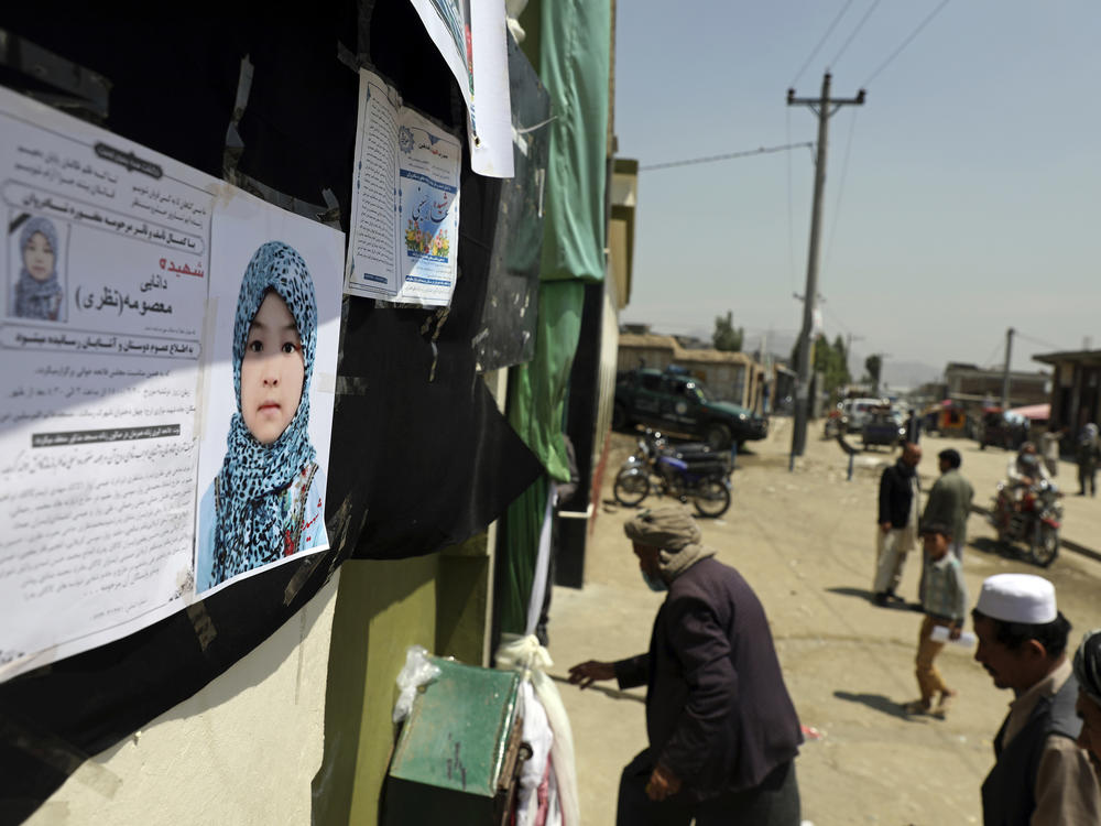Afghans arrive on Monday at a memorial ceremony for Masooma Nazari, a student killed on Saturday near a school in Kabul.