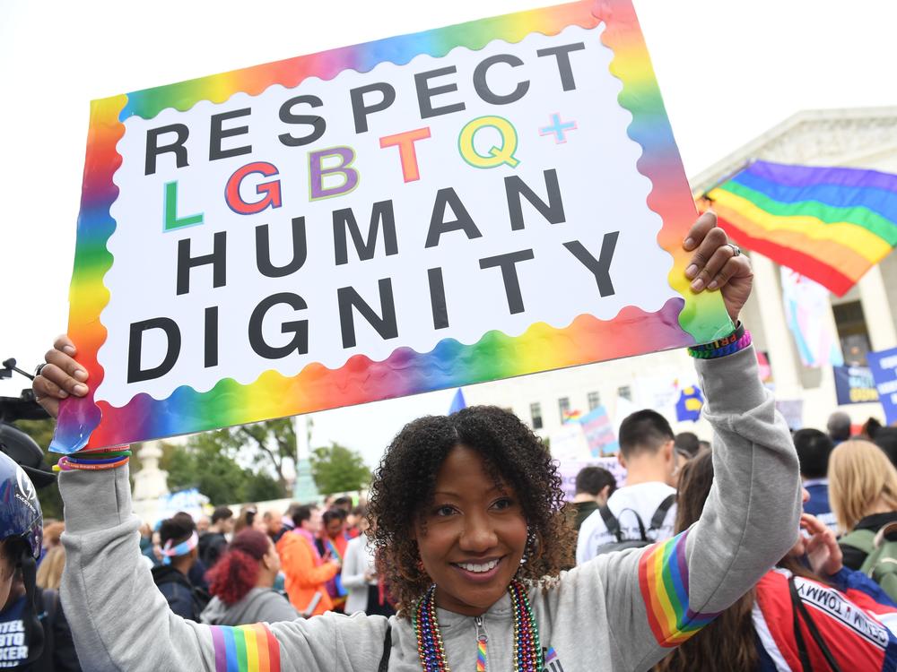 A new report by GLAAD highlights the high rate of harassment and hate facing LGBTQ users on social media. In this photo, demonstrators rally in favor of LGBTQ rights outside the U.S. Supreme Court in 2019.