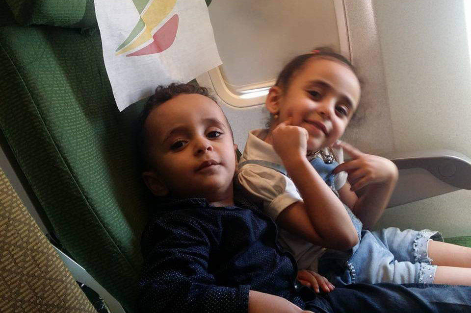 Alsaeedi's daughters Nada, then 6, and Mazeen, then 3, on a plane from Aden, Yemen, to Djibouti in 2017. They and their family traveled there hoping to complete the process to obtain visas that would grant them a new life in the U.S. but were turned back because of the Trump administration's travel ban.