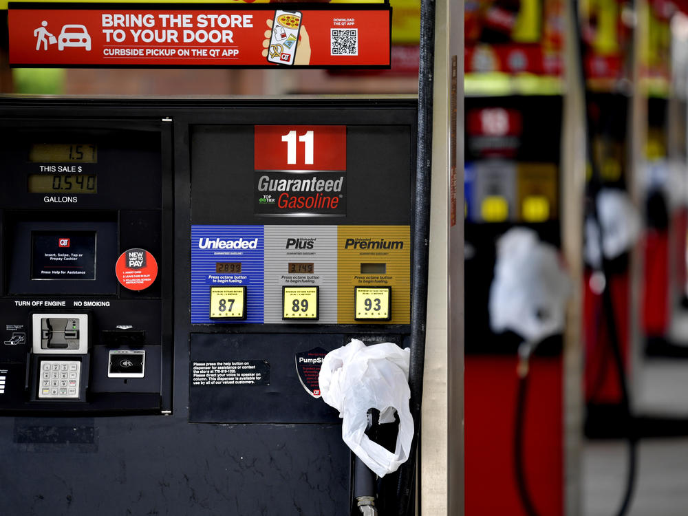A QuikTrip convenience store in Kennesaw, Ga., has bags on its pumps Tuesday to indicate it has no gas. Colonial Pipeline, which delivers about 45% of fuel consumed on the East Coast, halted operations last week after a cyberattack.