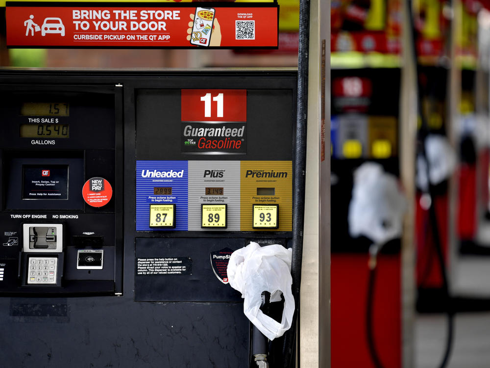 A QuikTrip convenience store in Kennesaw, Ga., has bags on its pumps Tuesday to indicate it has no gas. Colonial Pipeline, which delivers about 45% of fuel consumed on the East Coast, halted operations last week after a cyberattack.