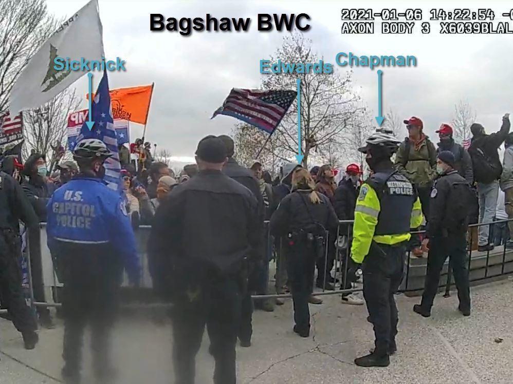 This image from a video released by the Justice Department shows Capitol Police officers, including Brian Sicknick, attempting to hold back a crowd that ultimately breached the U.S. Capitol on Jan. 6.