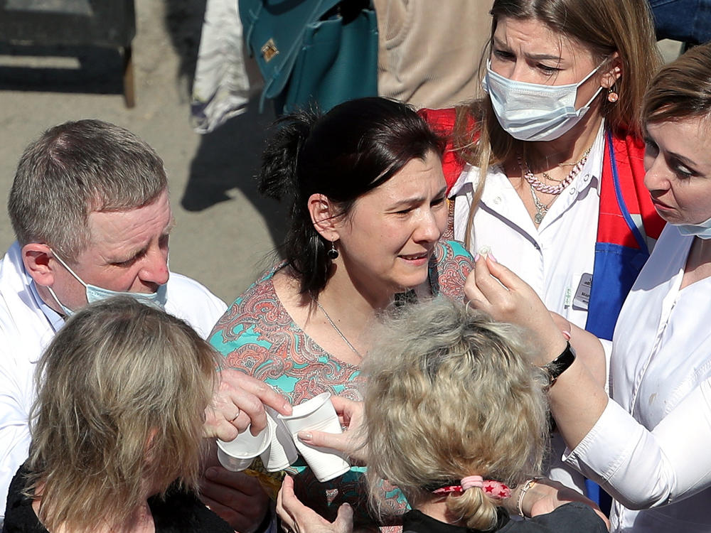 Relatives of students who attend a school in the Russian city of Kazan, where a gunman opened fire on Tuesday, killing several students and at least one teacher and injuring more than 20 others.