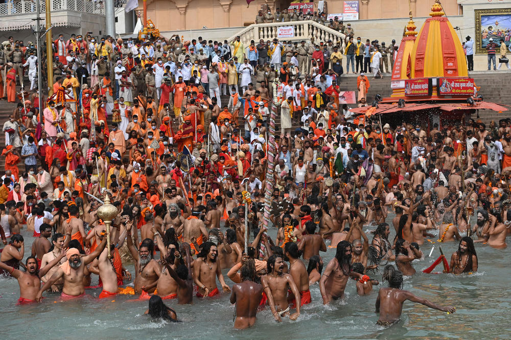 Naga sadhus (Hindu holy men) take a holy dip in the Ganges River during the Kumbh Mela festival in Haridwar, India, on April 12.