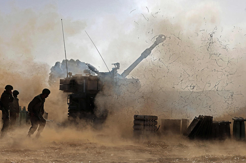 Israeli soldiers fire a 155 mm self-propelled howitzer toward the Gaza Strip from their position near the southern Israeli city of Sderot on Wednesday. Israeli Defense Minister Benny Gantz vowed more attacks on Hamas and other Palestinian militant groups in Gaza to bring 