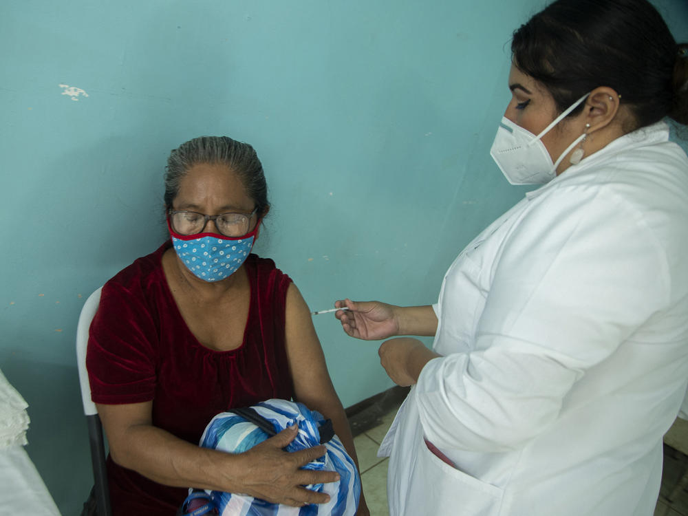 A woman receives a dose of the Covishield vaccine against COVID-19, at the Francisco Buitrago Health Center in Managua, on April 7.