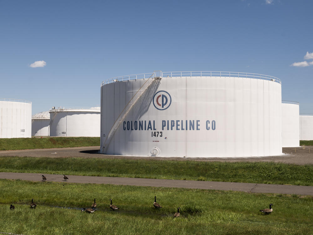 President Biden alluded to the Colonial Pipeline cyberattack in his new executive order. Here, storage tanks at a Colonial Pipeline facility are seen Wednesday in Avenel, N.J.