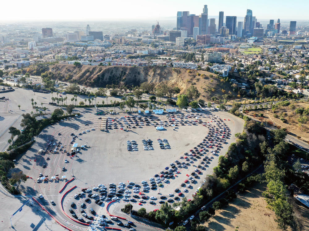 Cars line up at Dodger Stadium for coronavirus testing on the Monday after Thanksgiving weekend, Nov. 30, 2020, in Los Angeles.