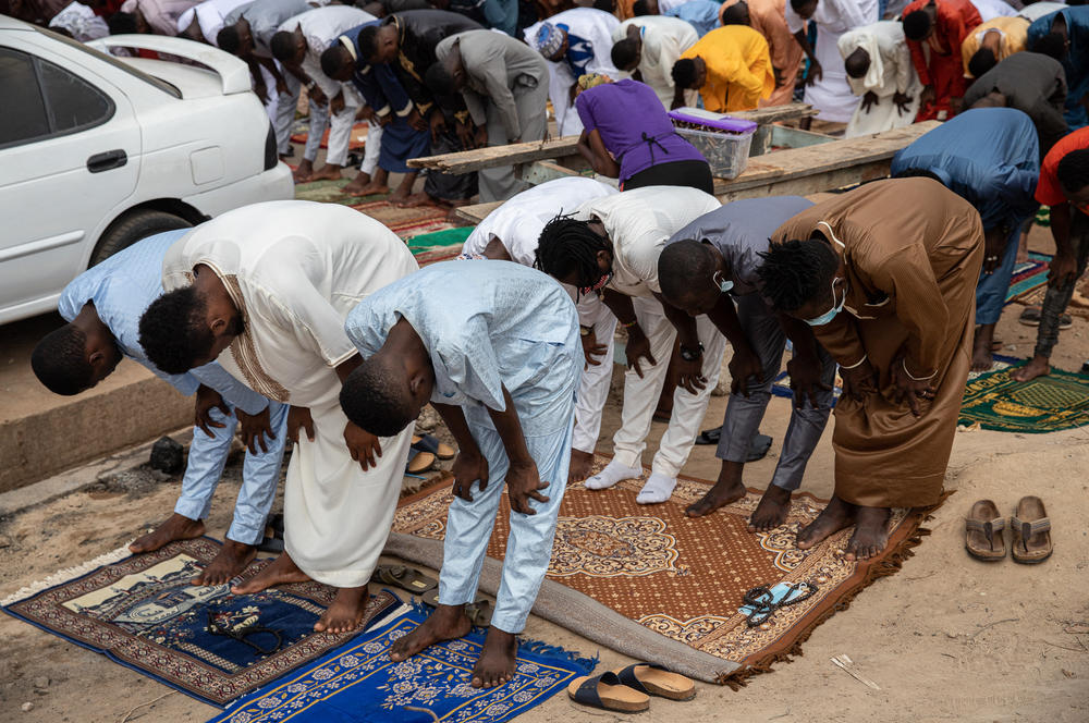 Muslims pray on a street in Accra, Ghana, on Thursday to mark the end of Ramadan.