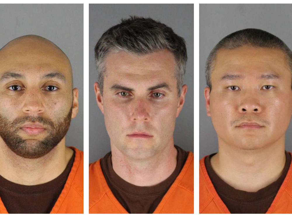 Former Minneapolis Police officers, from left, J. Alexander Kueng, Thomas Lane and Tou Thao. Their trial on charges related to the killing of George Floyd has been delayed until March 2022.
