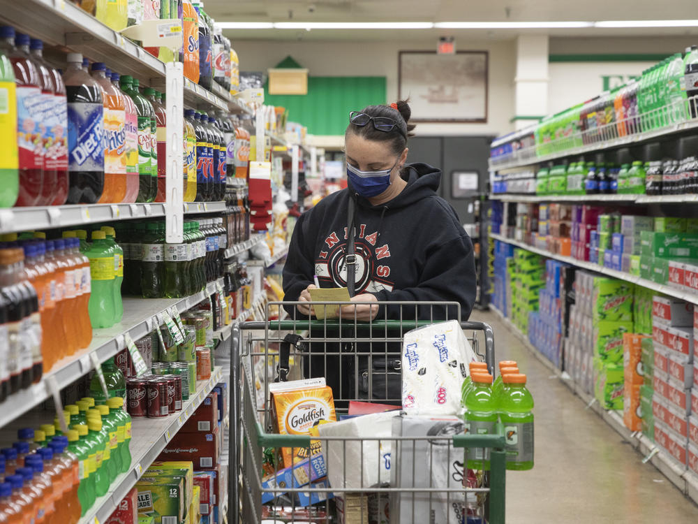 The CDC's new guidelines on face coverings and social distancing are raising questions about grocery store requirements moving forward.