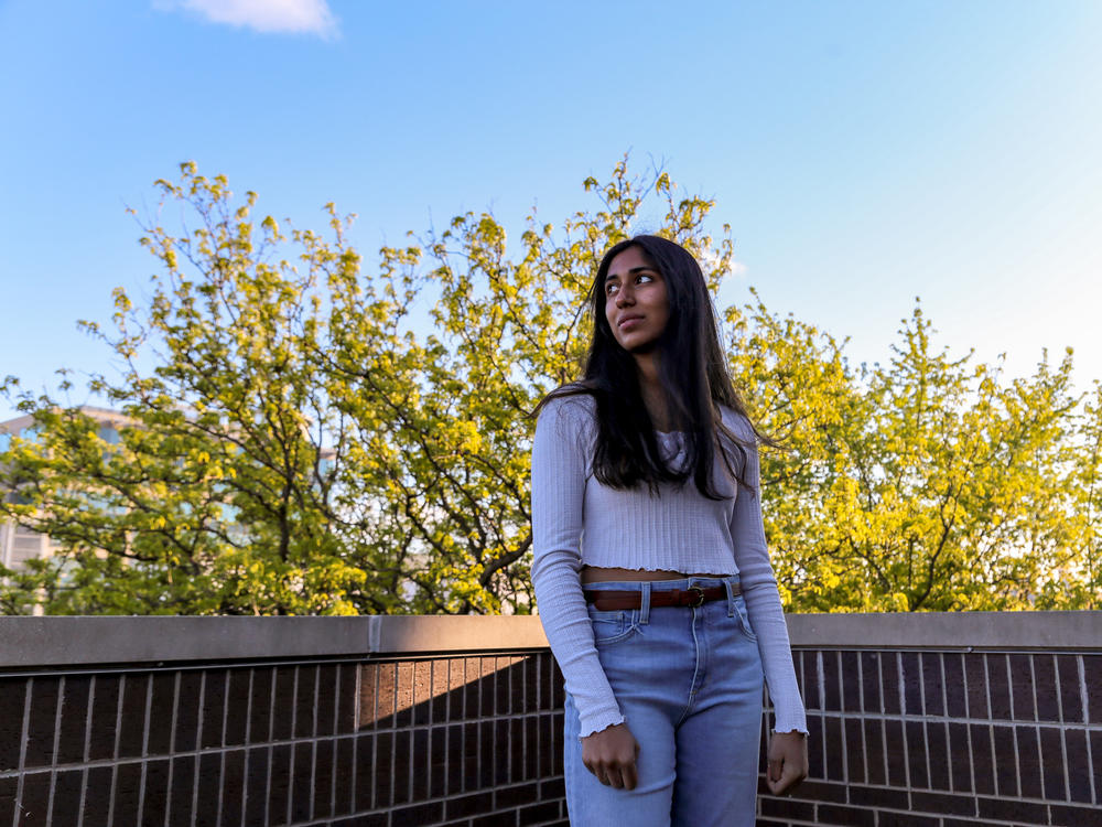 NPR Student Podcast Challenge winner Kriti Sarav poses for a portrait while on the top balcony of her family's home in Chicago.