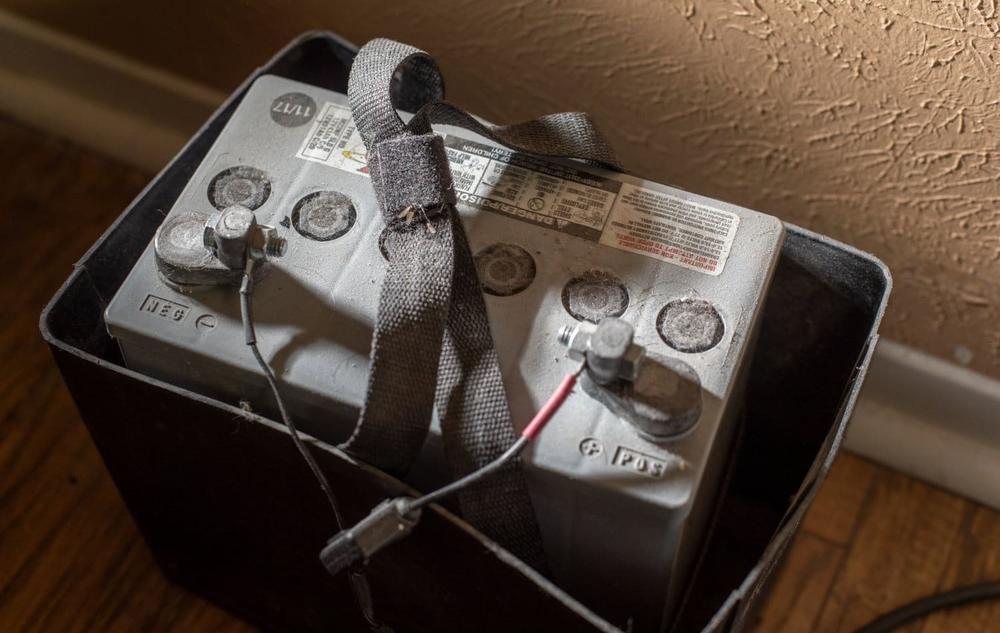 A car battery serves as a backup power supply for David Taylor's ventilator, which he must use at all times. The battery was projected to provide power for just eight hours.