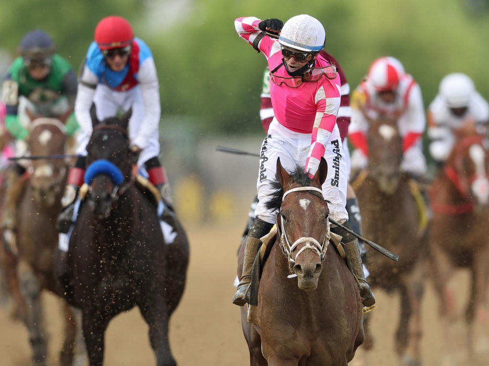 Jockey Flavien Prat, #6, riding Rombauer, celebrates as he wins the 146th running of the Preakness Stakes at Pimlico Race Course on Saturday in Baltimore.