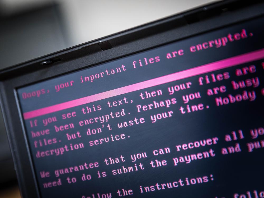A laptop displays a message after being infected by ransomware in 2017. Thousands of institutions  in the U.S. fall victim to ransomware attacks each year.