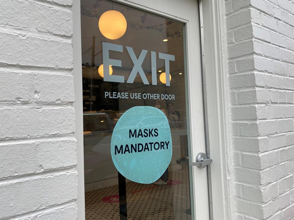 Some businesses, including Jeni's Splendid Ice Creams, are still requiring customers to wear masks indoors, despite new guidance from the CDC that it's safe for fully vaccinated people to go without them.
